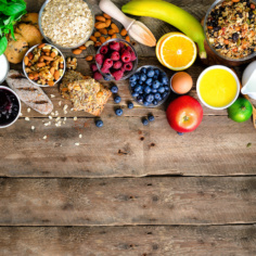 Healthy Breakfast Ingredients, Food Frame. Granola, Egg, Nuts, Fruits, Berries, Toast, Milk, Yogurt, Orange Juice, Cheese, Banana, Apple On Wooden Rustic Background, Top View, Copy Space