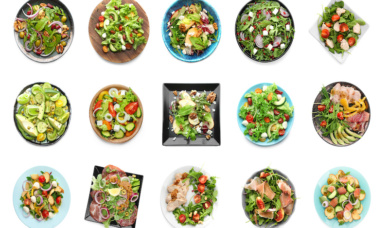 Set Of Different Tasty Salads On White Background