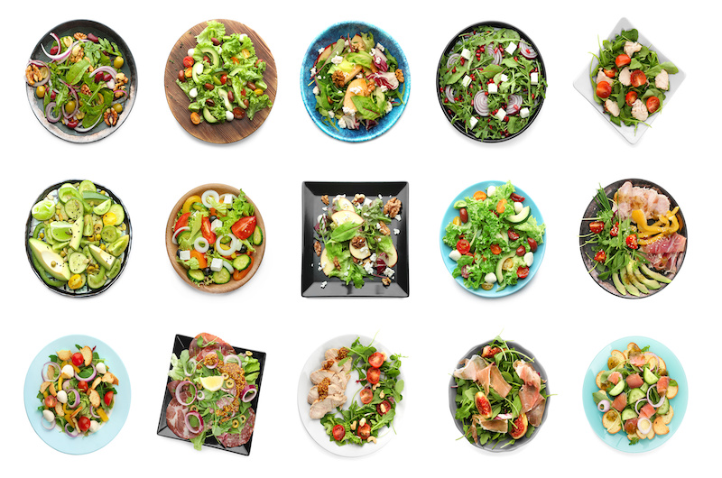 Set Of Different Tasty Salads On White Background